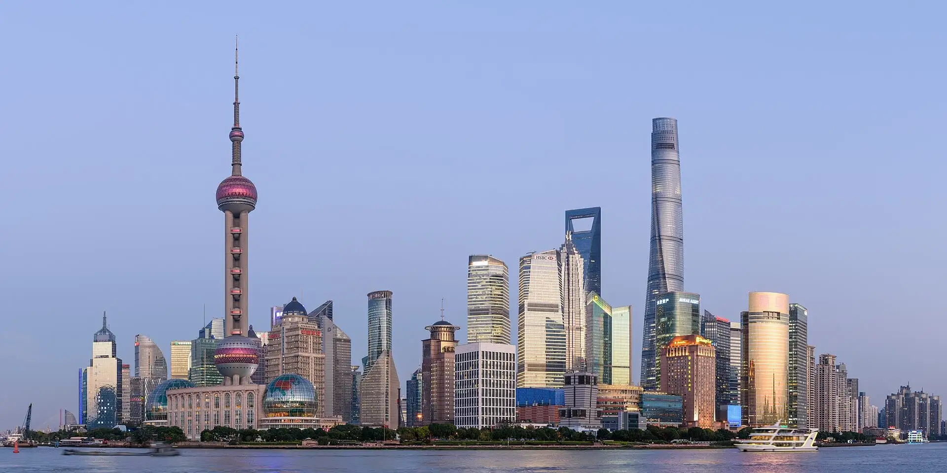 The Pudong skyline in Shanghai at dusk, seen across the Huangpu River