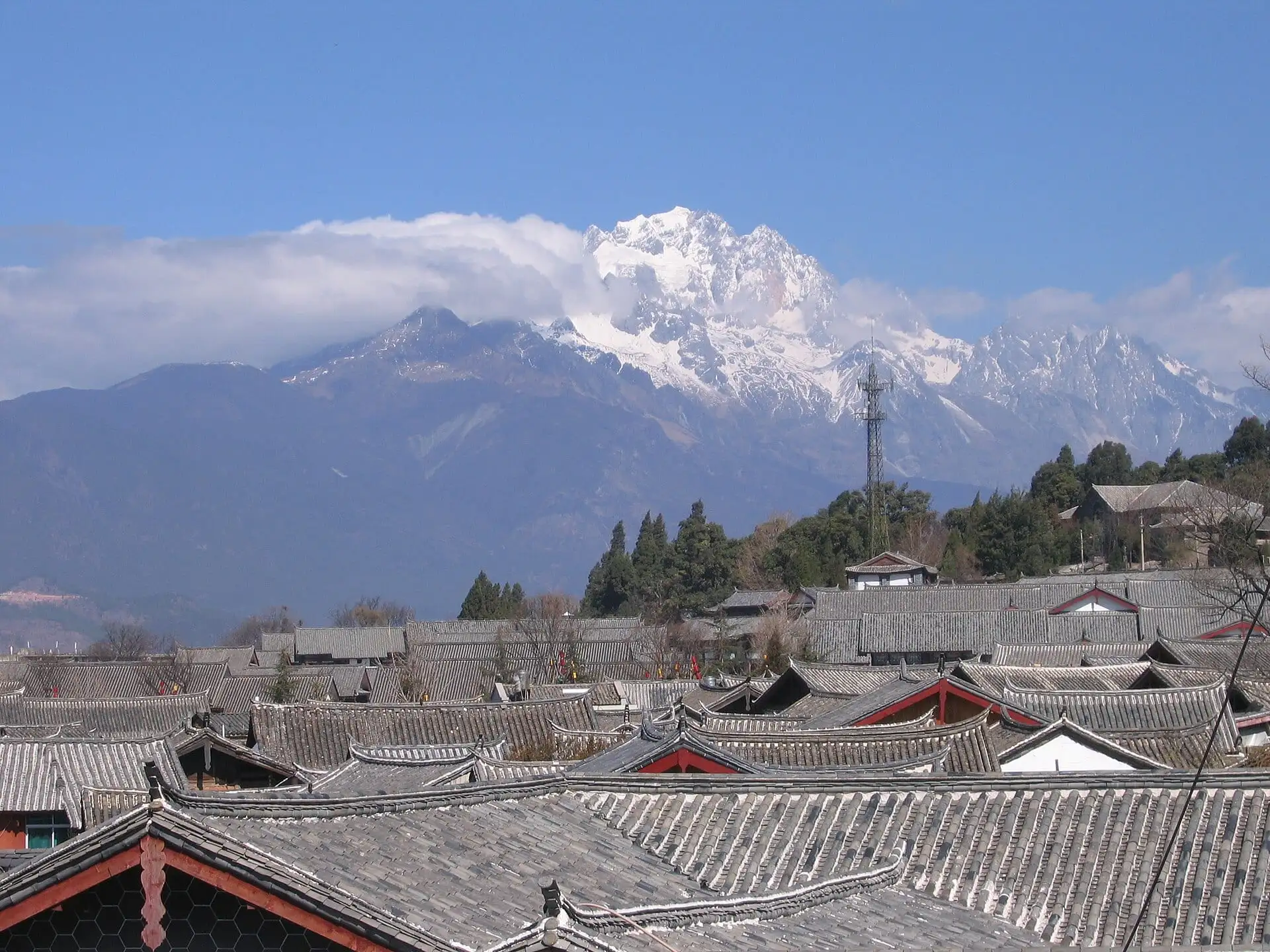 Rooftops of Lijiang Old Town with Jade Dragon Snow Mountain behind